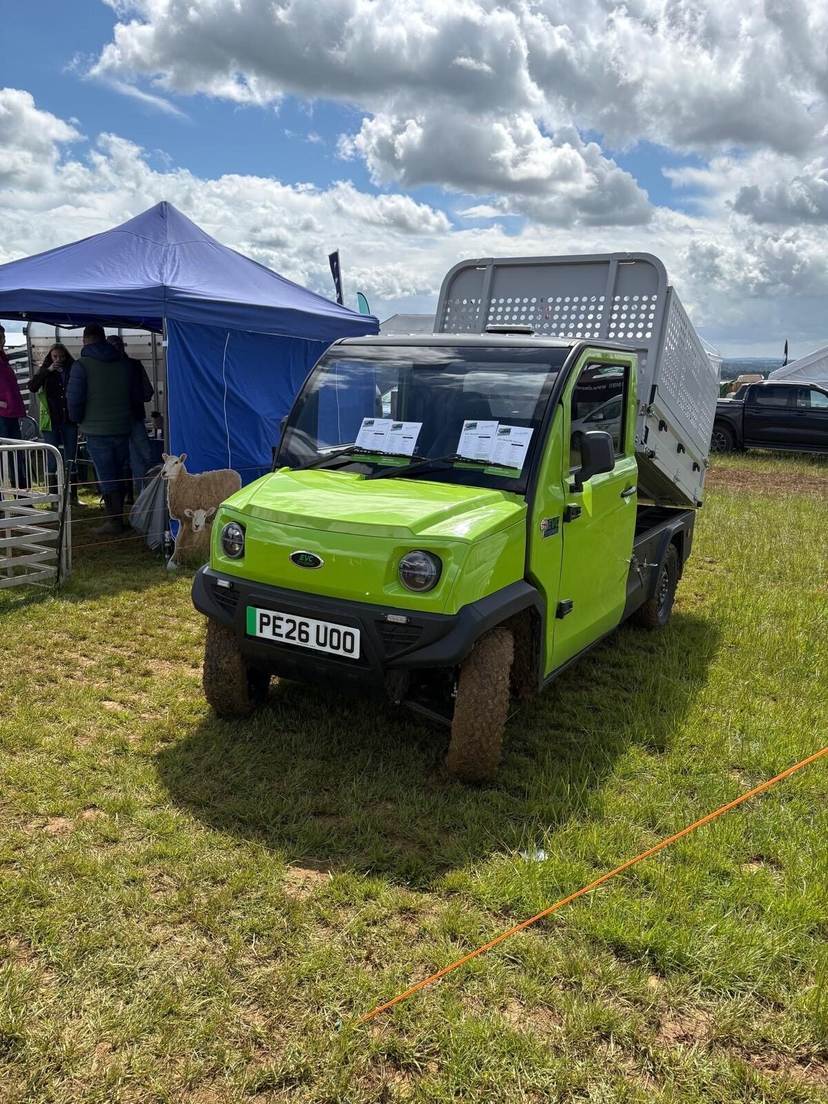 The lime green CitySprint Cargo Box out in the field
