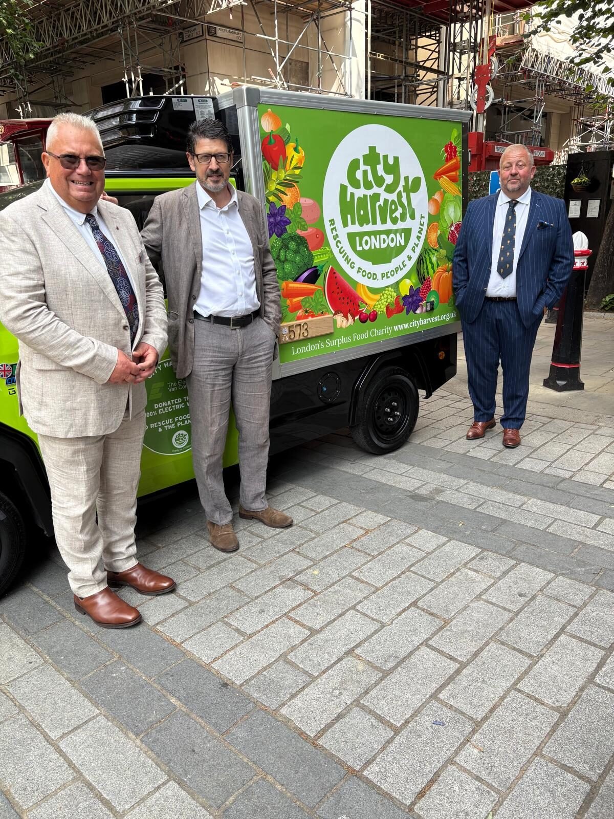 Keith Sims and Hal Jackson hand over the donated CitySprint to City Harvest