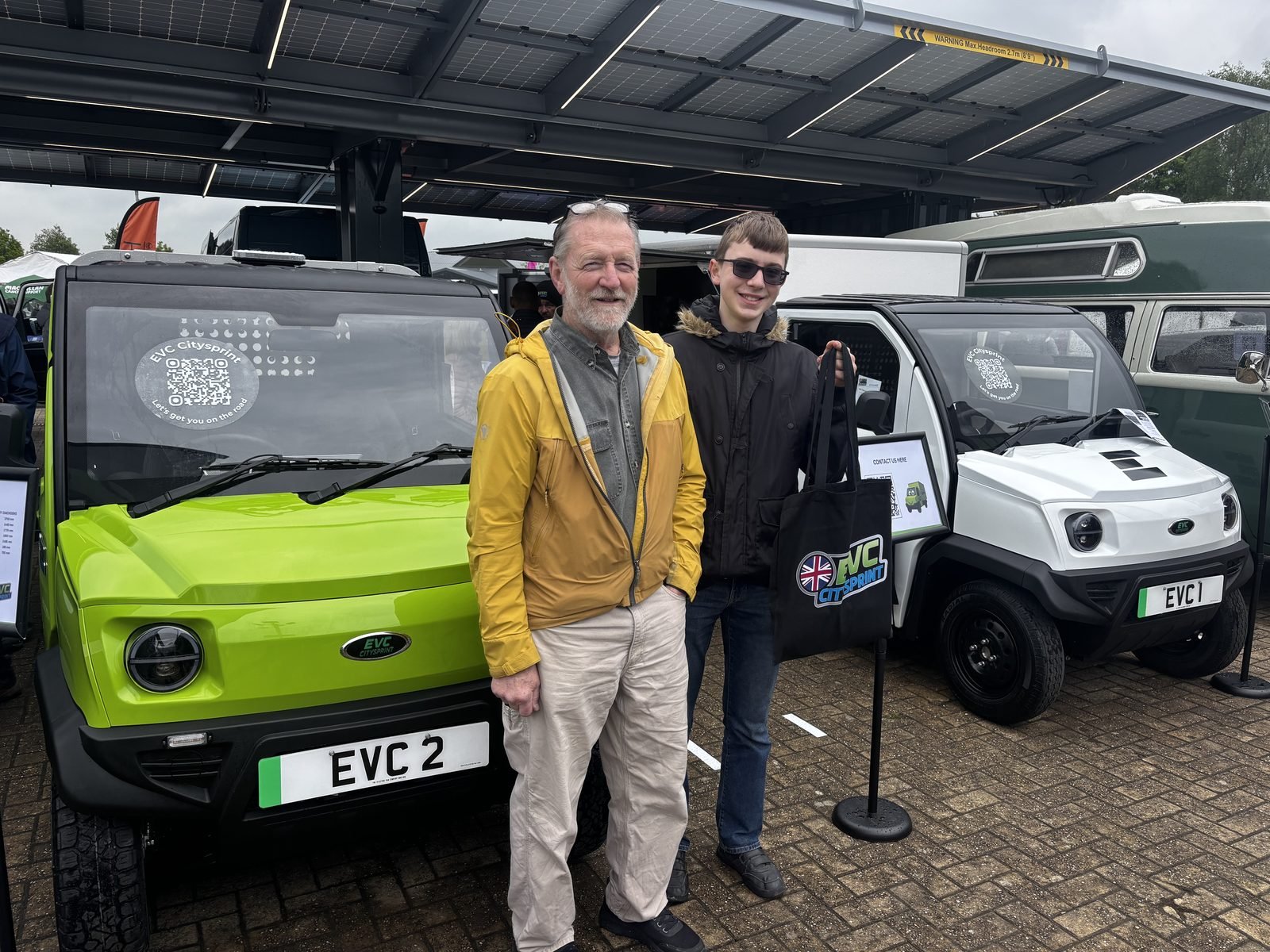 Visitors examining the lime green and white CitySprint configurations
