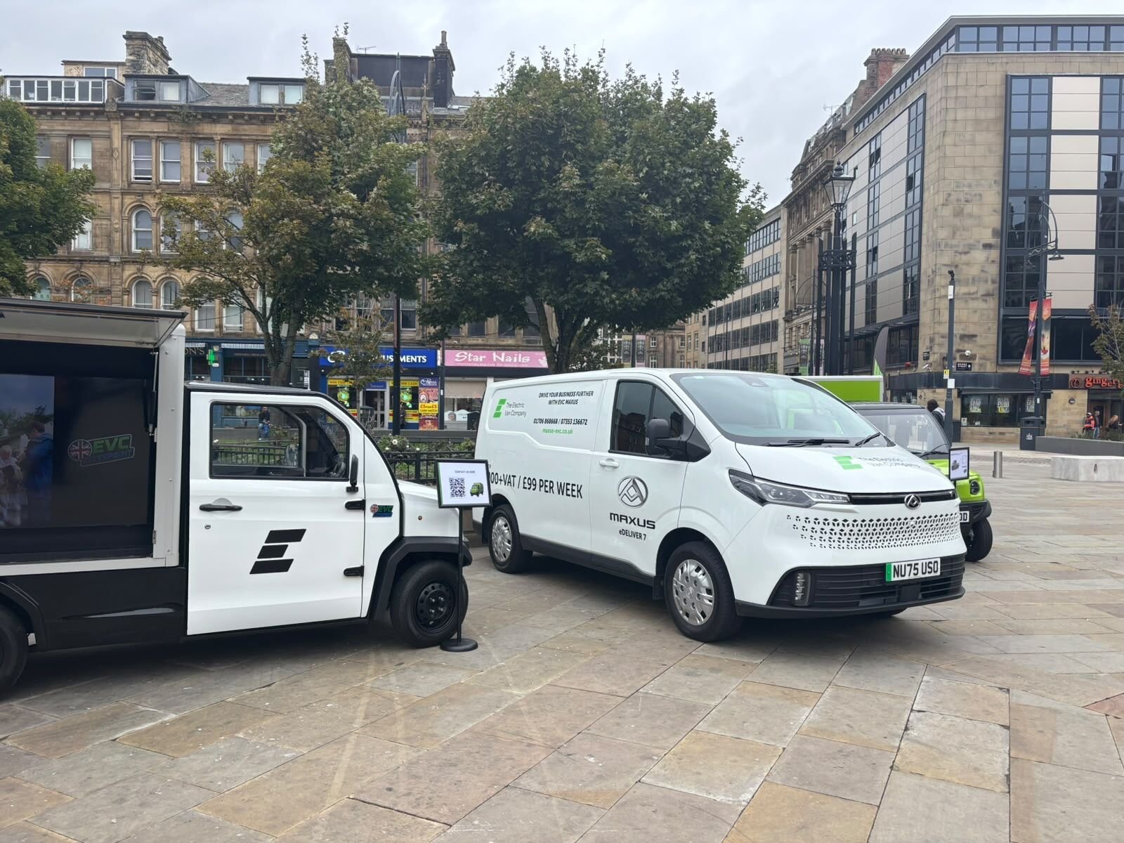 The Mobile Advertising Vehicle and a Maxus van in Centenary Square
