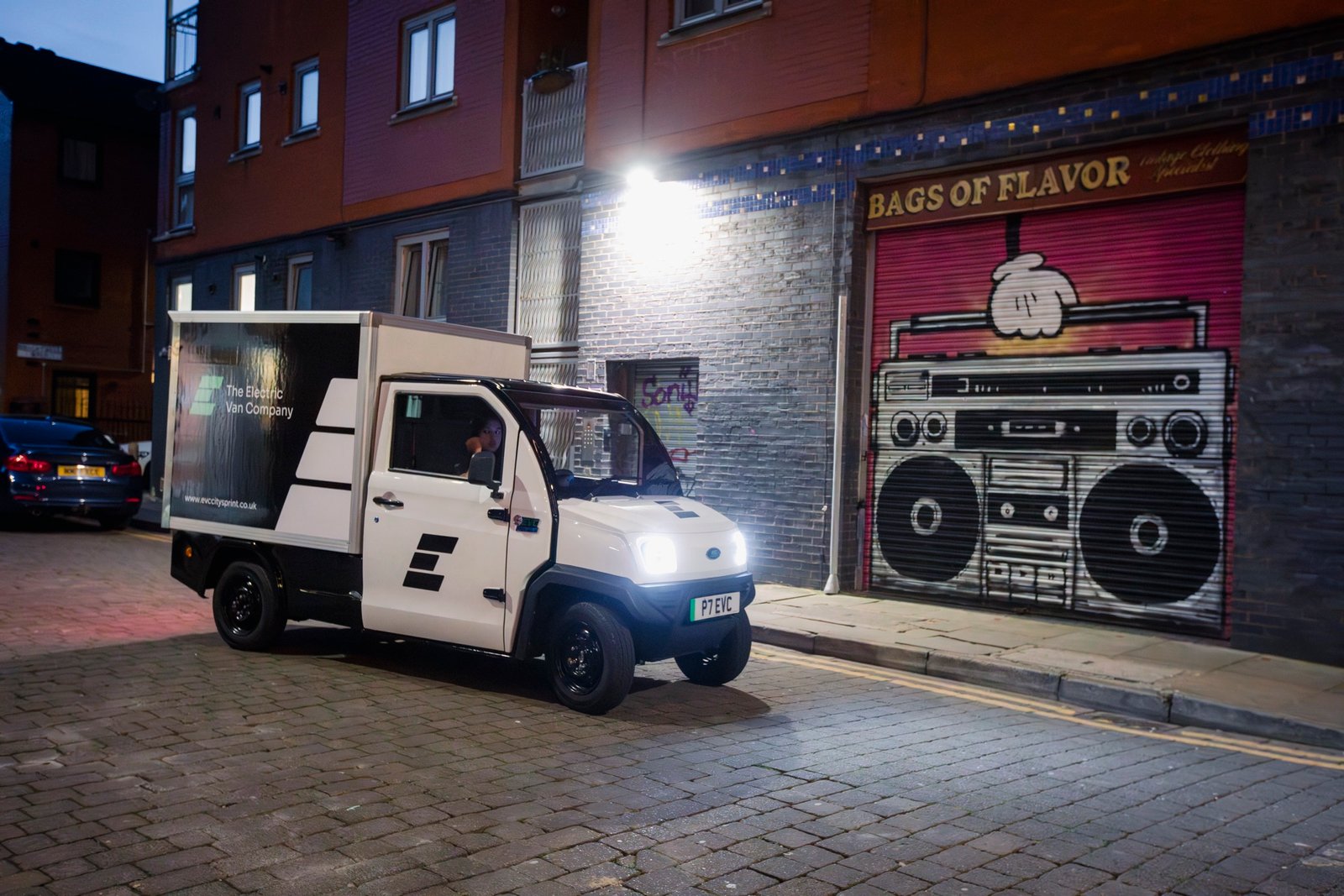EVC CitySprint on a night delivery run past street art